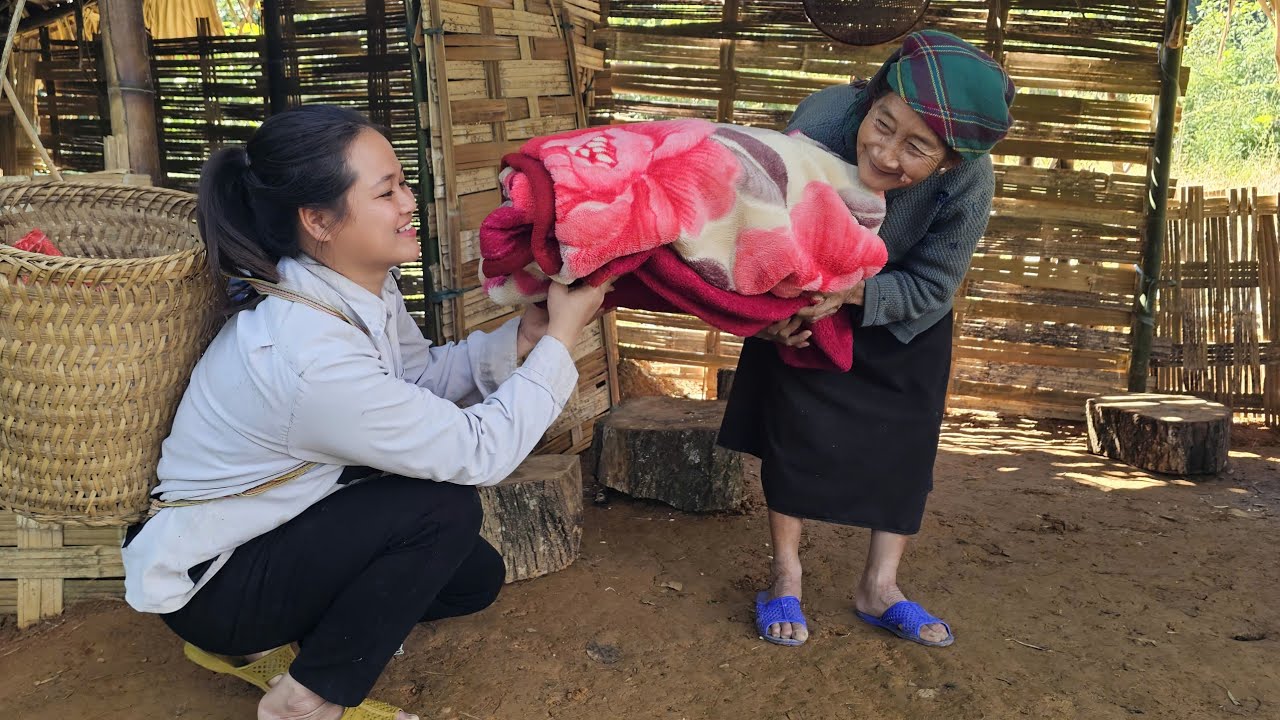 The old lady really liked the new blanket the girl had just bought.