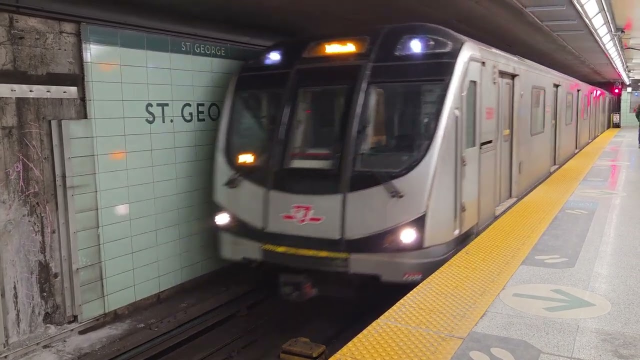 TTC Line 1 and Line 2 trains at St. George Station.