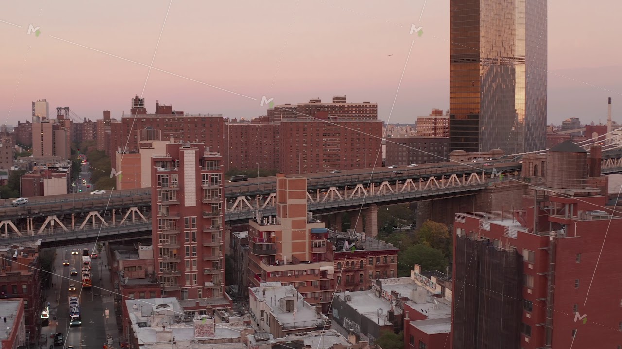 AERIAL: Scenic look over New York City bridge at sunset