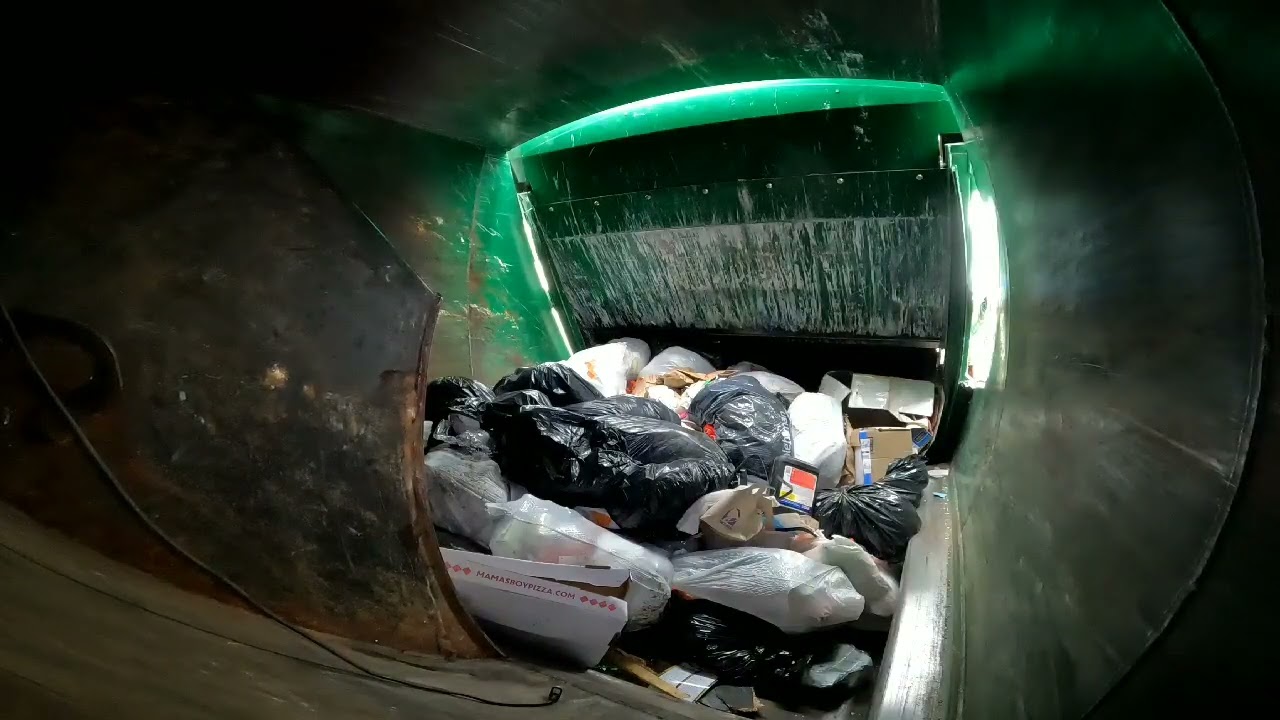 Inside P.O.V Waste Management Autocar / Mcneilus Rear end loader garbage truck