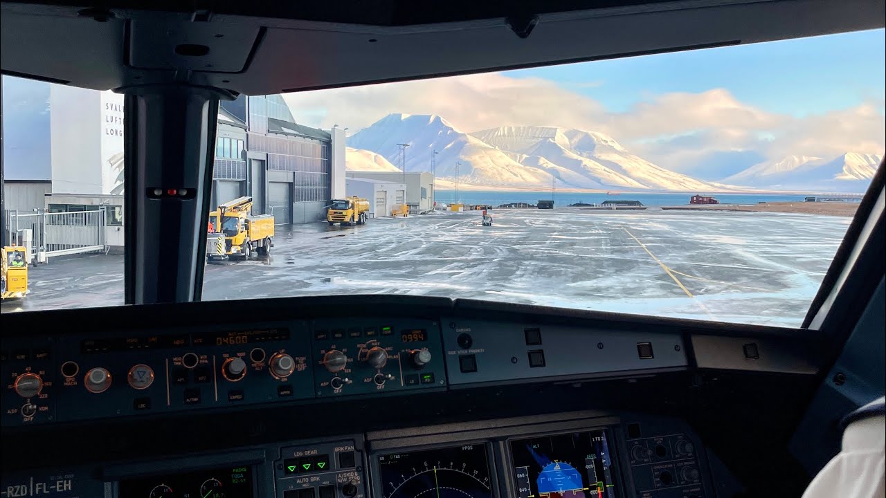 Cockpit Landing at Svalbard Airport – Arctic Approach Over Snowy Mountains