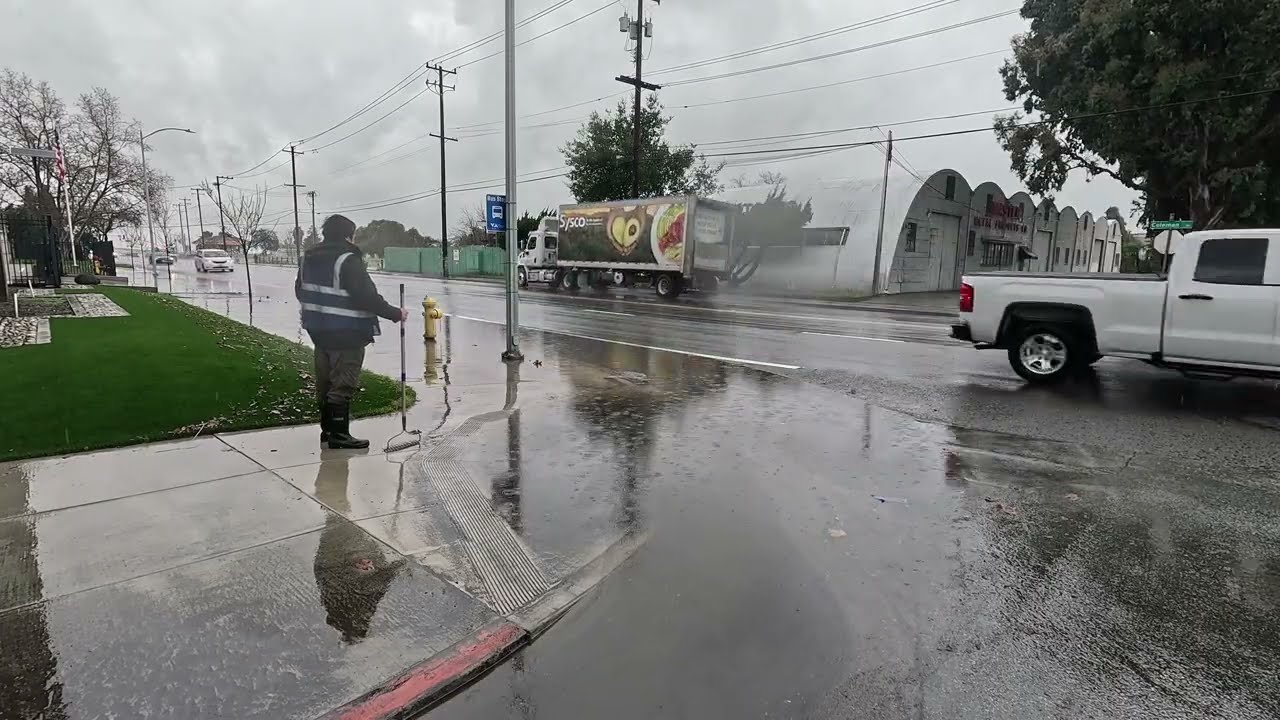I unclogged a drain to stop flooding at this busy intersection.