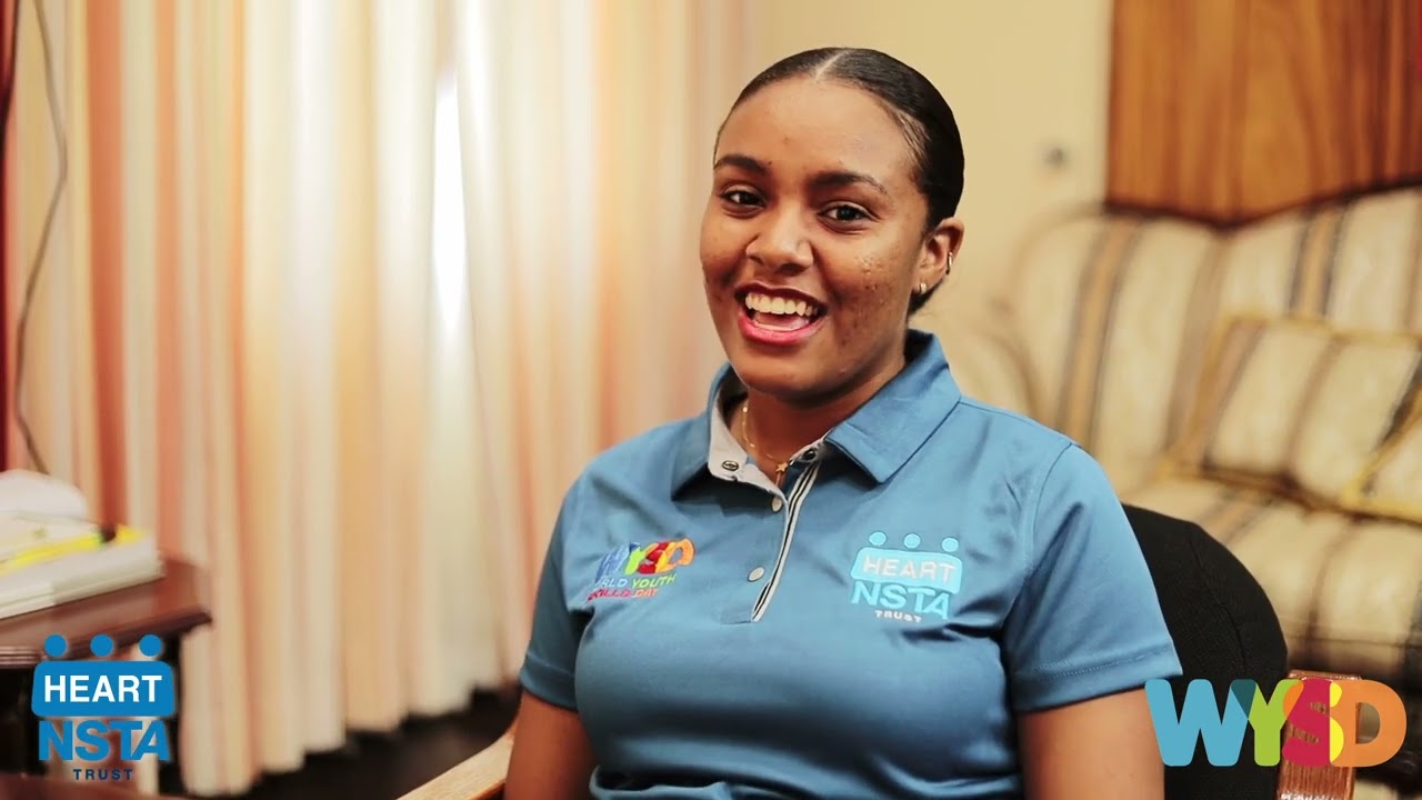 Senator the Honourable Dr. Dana Morris-Dixon  engages in conversation with youth.