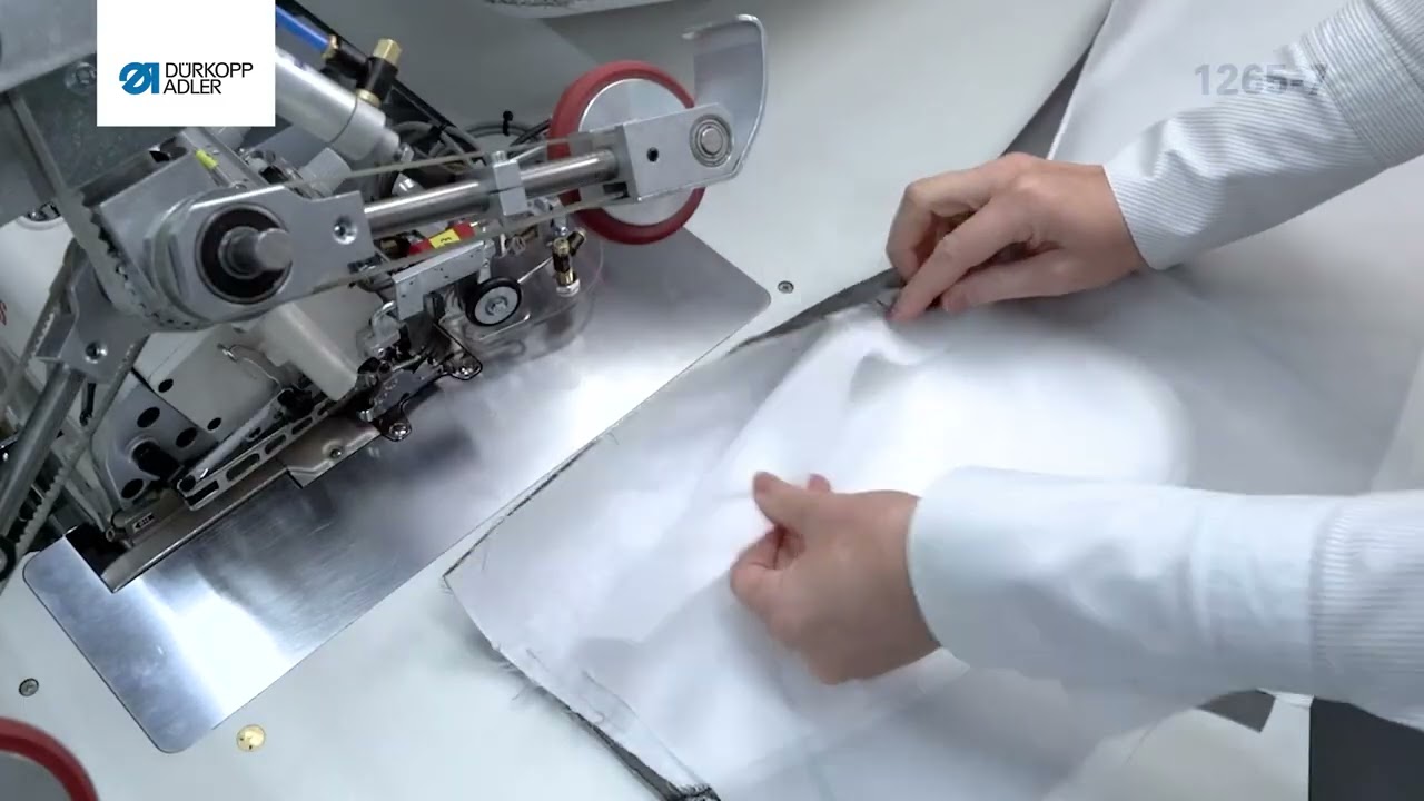 Durkopp Adler 1265-7 Автоматизована машина для обметування передніх і задніх частин штанів.