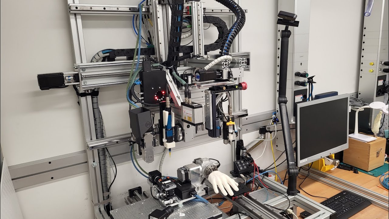 An 8 axis multi-material 3D printing system