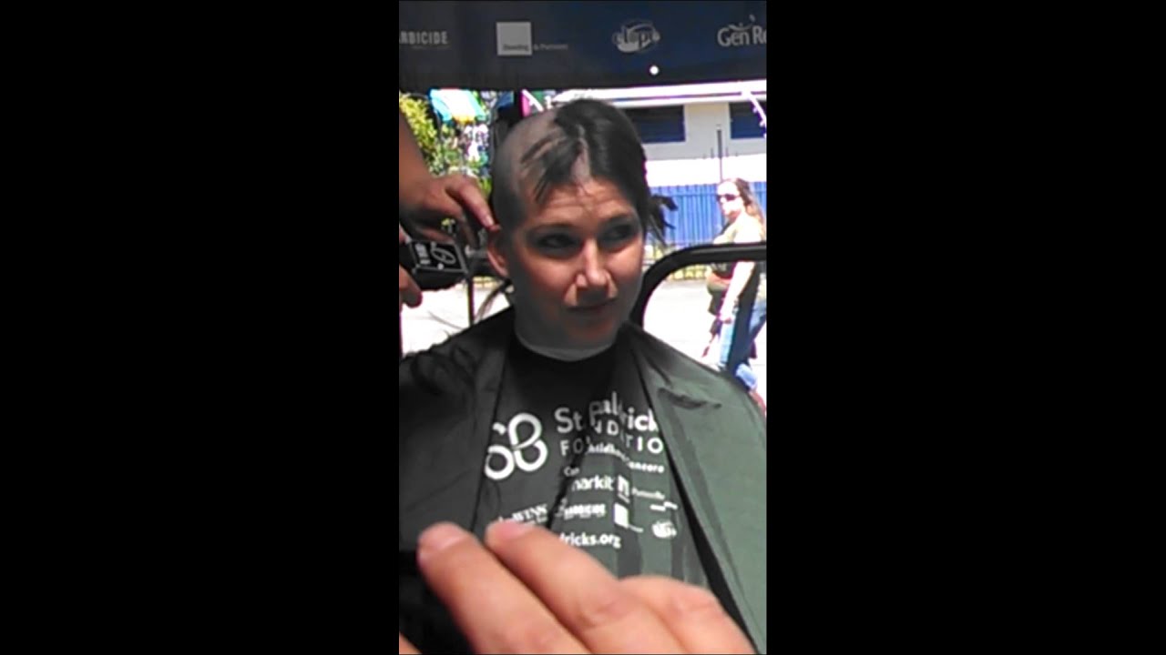 Mom and daughter shaving their heads.