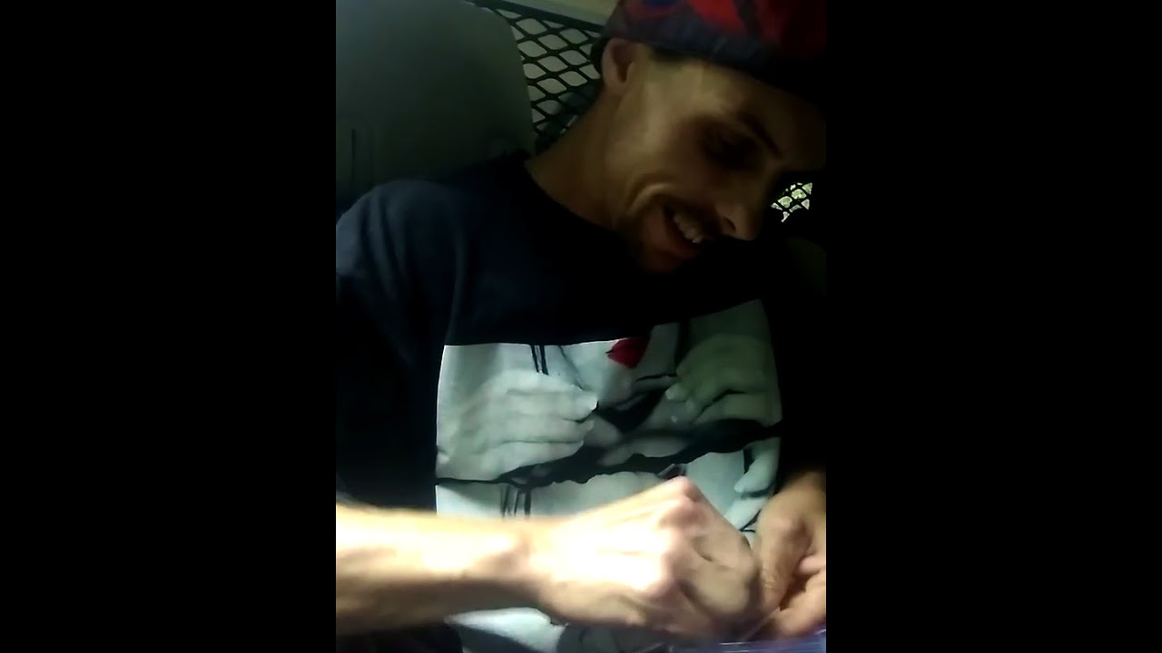 Rolling a joint in a cop car