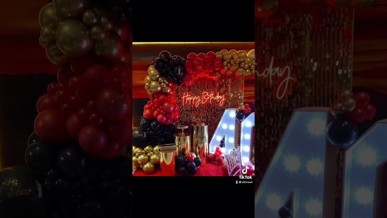 Gold Sequin wall set up with balloon Garland and table setting 40th shimmer wall