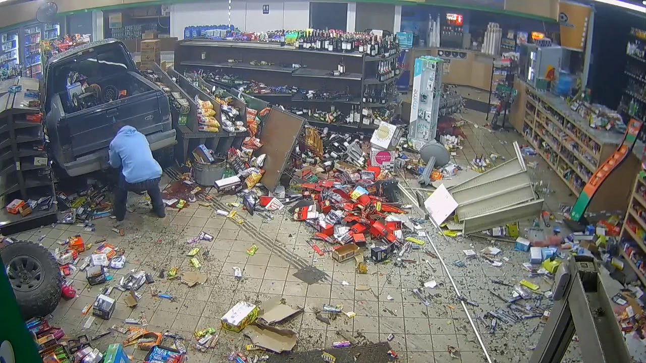 Man pulls off license plate after truck crashes into gas station