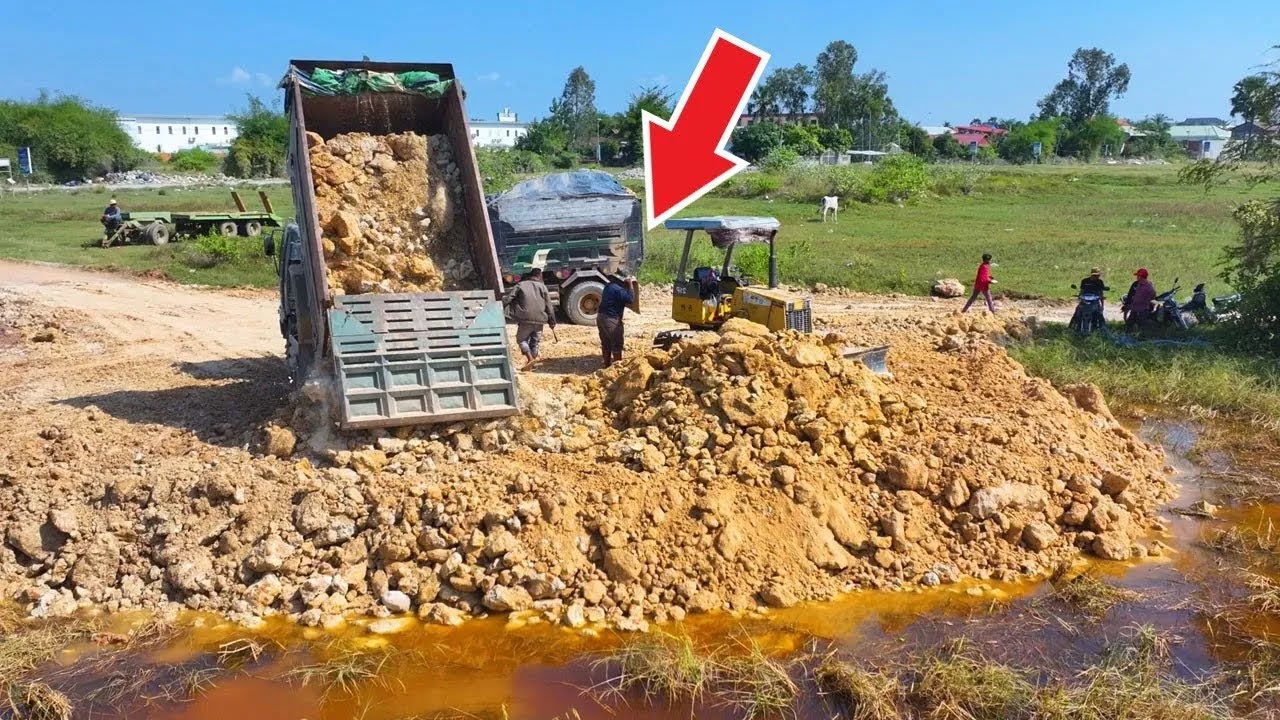 Landfill Project Begins! Dump Truck Dumps Soil Amidst Water and Debris