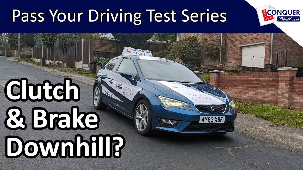 Slowing Down in a Manual Car Downhill - When to press the Clutch Down