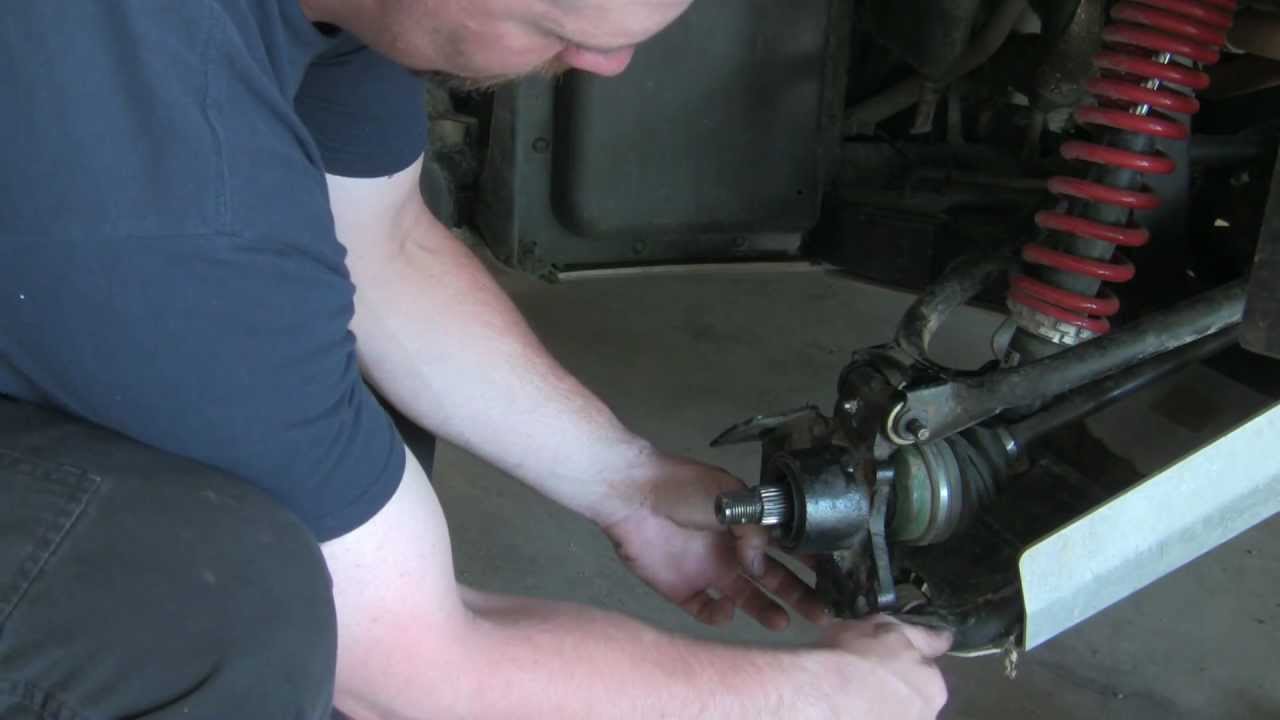 Removing the rear hub and replacing the bearings in the Yamaha Rhino!