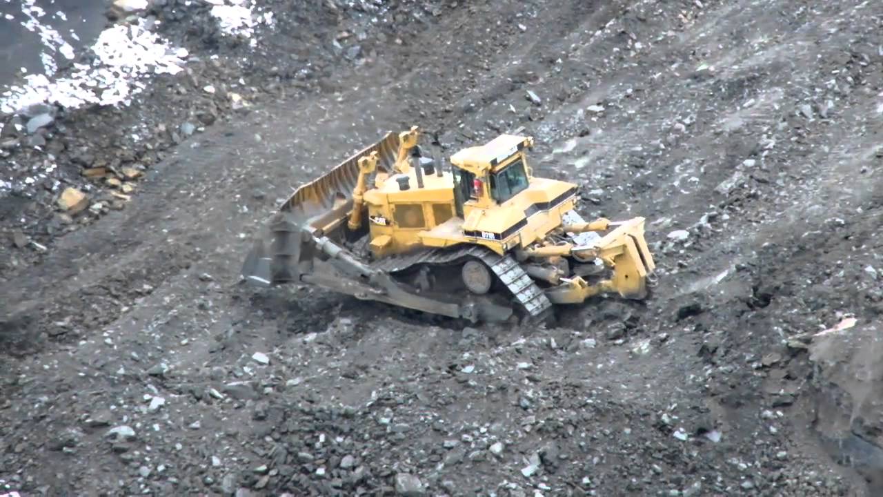 CAT D11-R Bulldozer Ripping Rock.