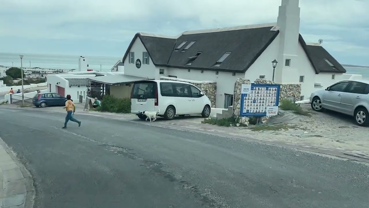Driving to & into the picturesque fisherman's village of Paternoster, locals waiting for the catch.