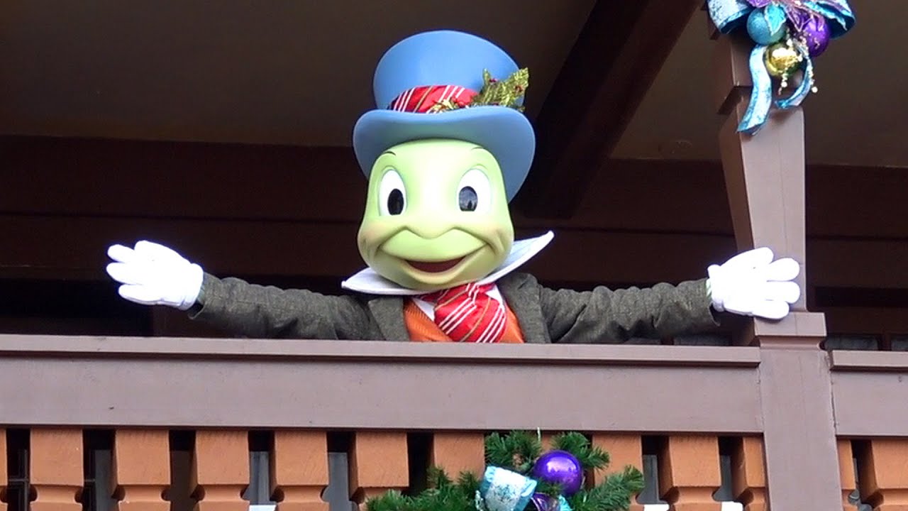 Jiminy Cricket in Holiday Outfit Greets Guests Distant - Pinocchio Village Haus, Magic Kingdom 2020