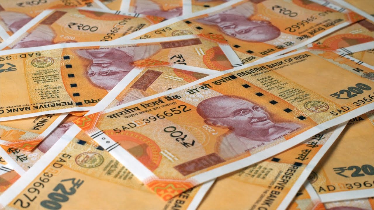 New Indian currency of 200 rupee notes falling on a currency heap | Indian Stock Footage | Knot9