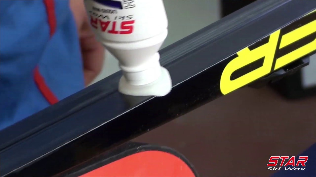 Application  of  Liquid glide wax on nordic ski with cork buffer