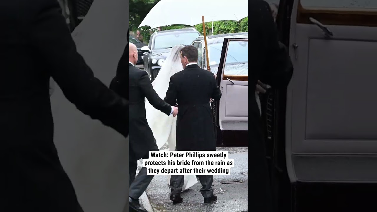 Watch: Peter Phillips sweetly protects his bride from the rain as they depart after their wedding