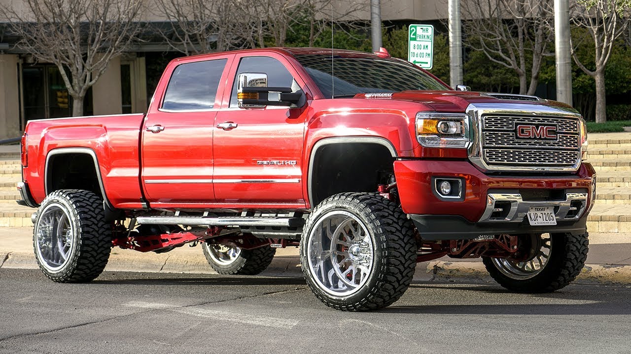 BEAUTIFUL RUBY RED 2018 DENALI DURAMAX ON 24X14S WITH 9 INCH LIFT! WEST TEXAS TRUCKS!