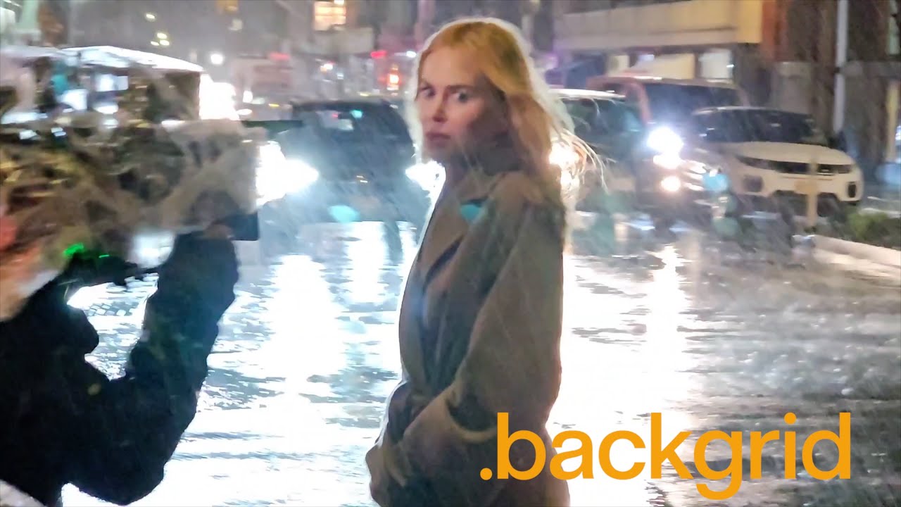 Nicole Kidman braves the rain on the set of 