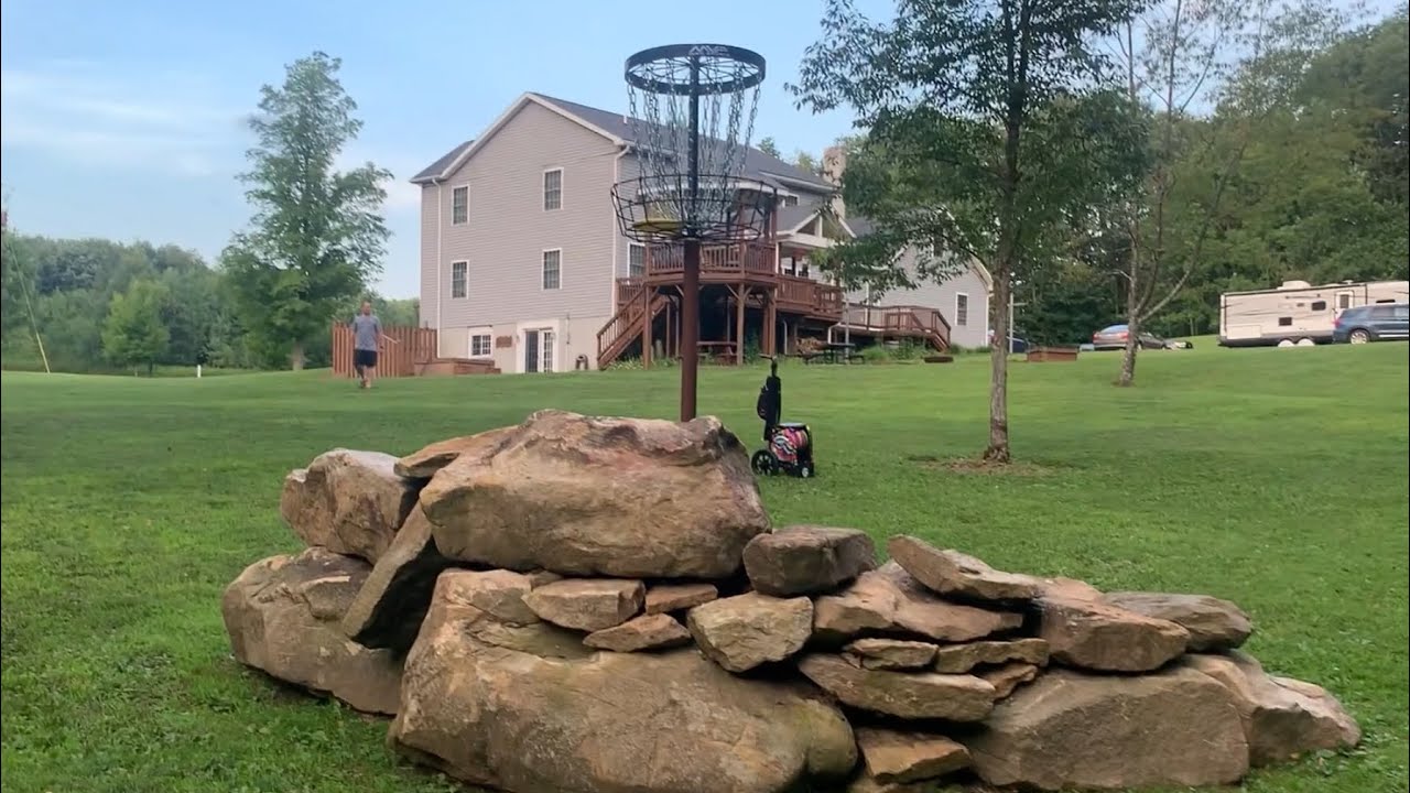 Playing an 18 hole disc golf course in a back yard!