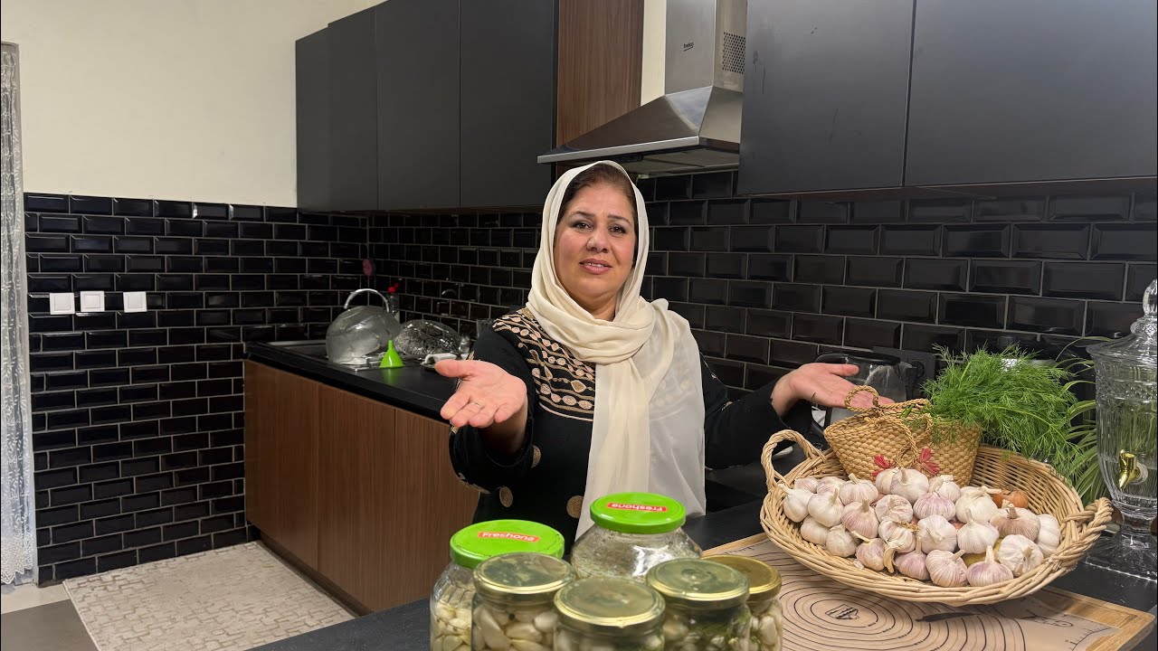 Preparing pickles from garlic for Ramadan. 