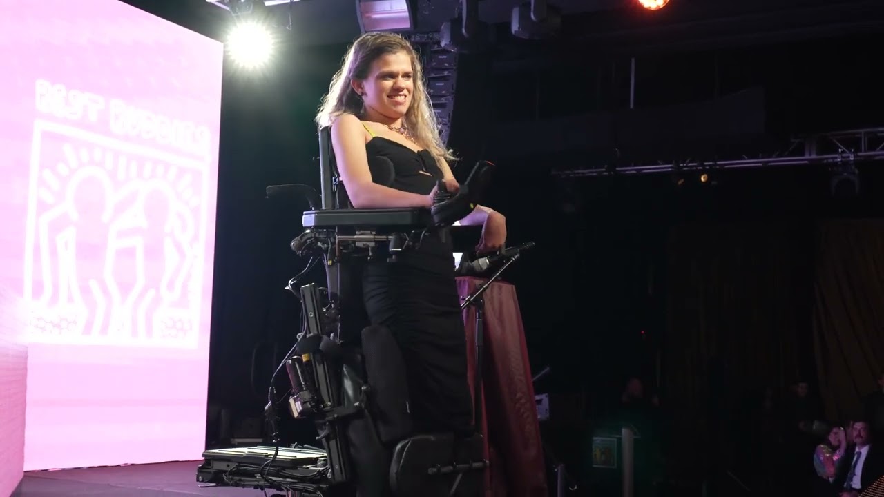 Best Buddies Global Ambassador Delaina Parrish speaking at the Best Buddies Miami Gala.