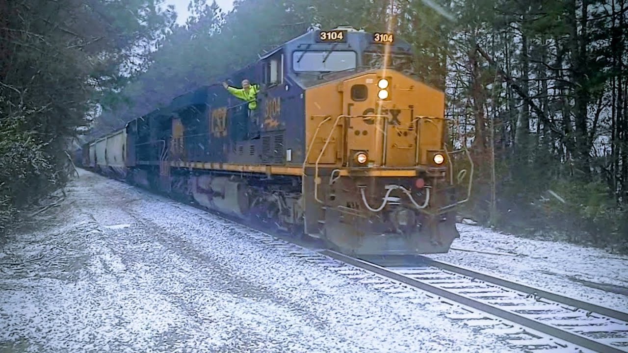 CSXT 3104 leads CSX L657 at Cayce SC with friendly wave from the conductor in the Snow 