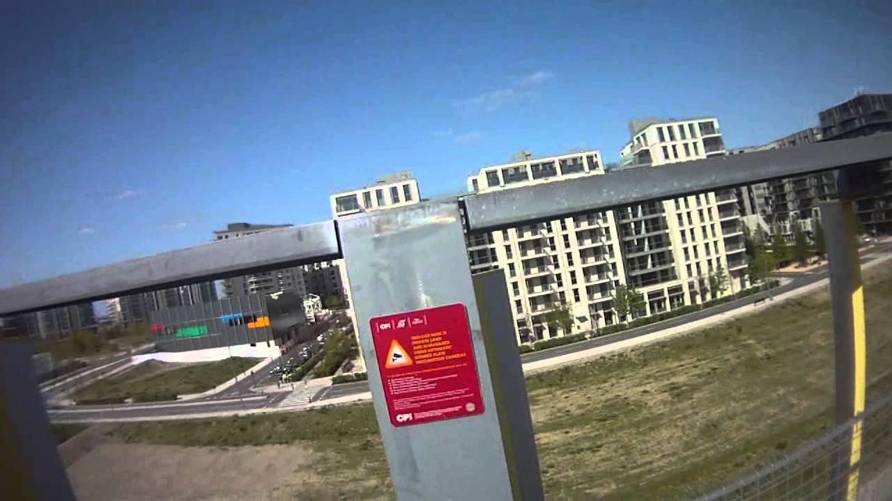 Aerial view of Olympic Village, SW19cam cycles up a multi-story car park.