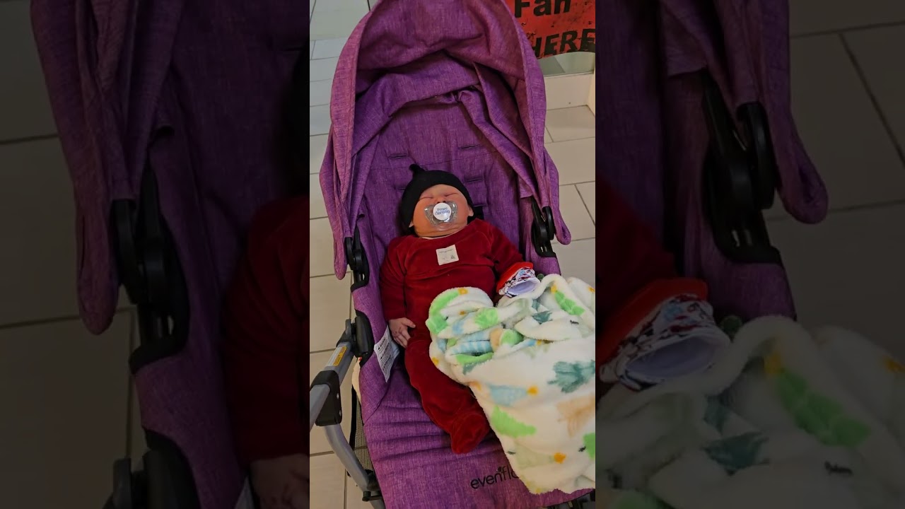 Ricky in the mall...chirstmas  shopping with mommyand daddy