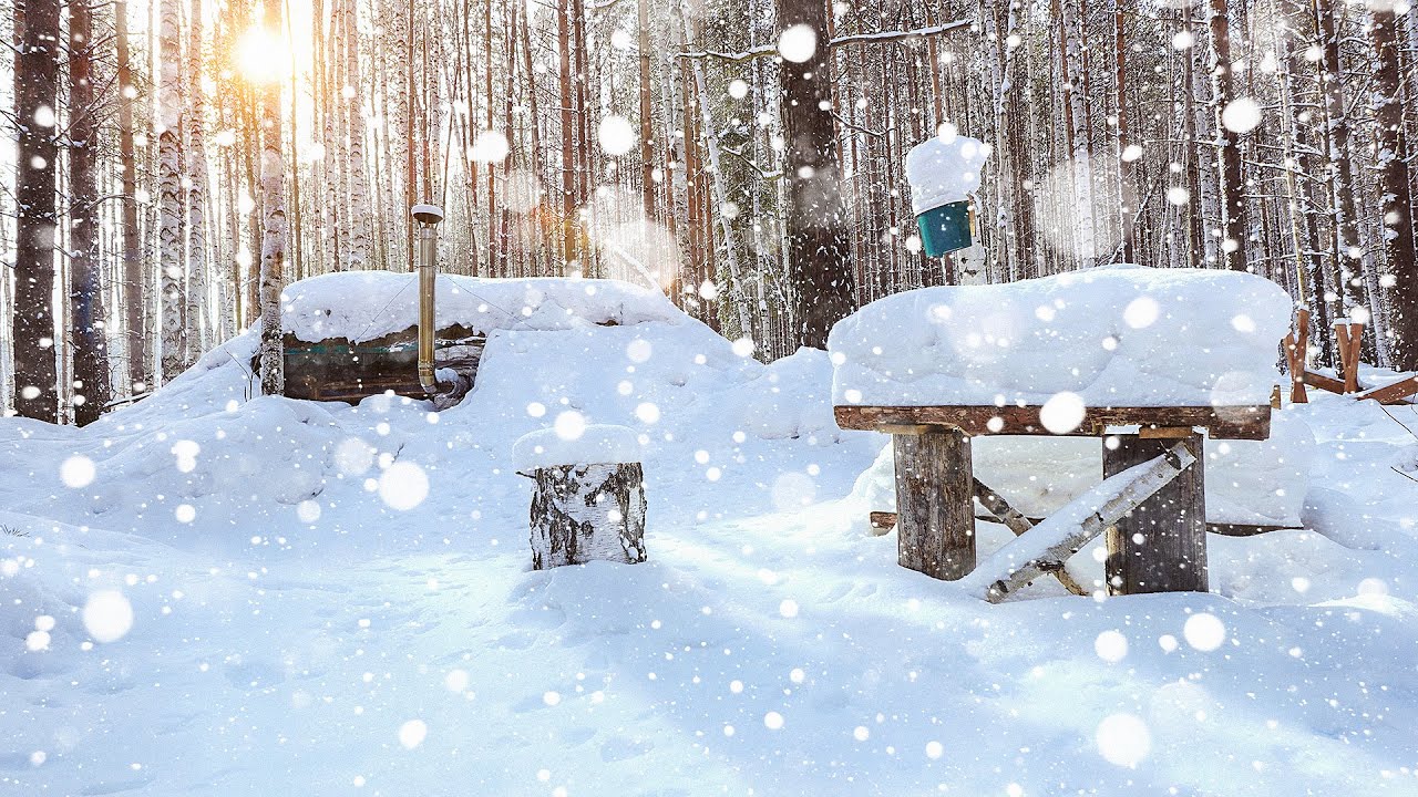 Winter shelter in the wild forest. +30 °C inside. Cooked dinner on the stove. Building a kitchen.