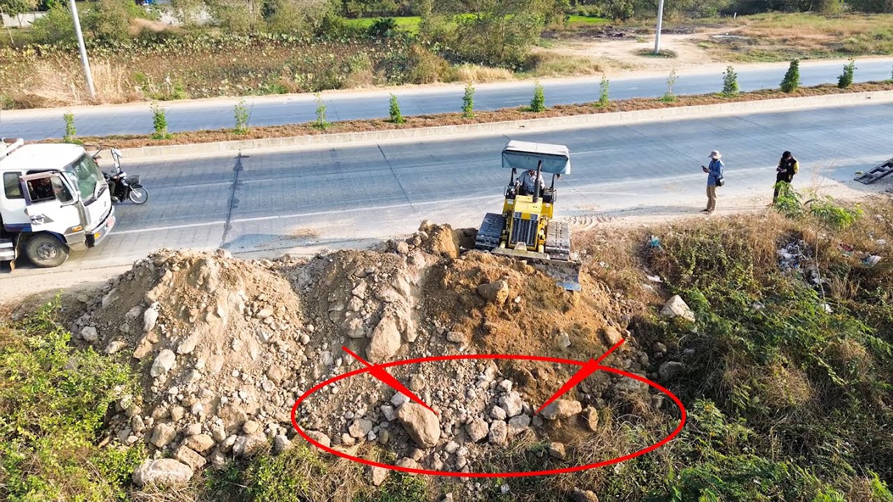 Excellent Bulldozer D20 starts up project landfill process with dump truck