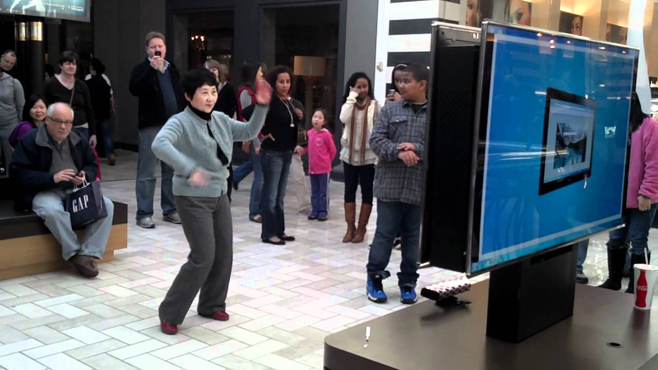 Asian Lady playing DDR Kinect for Xbox360