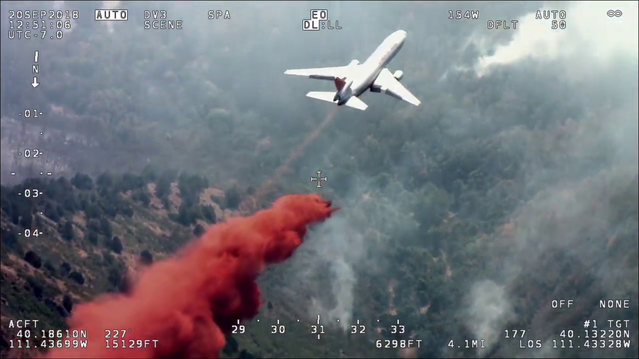Very Large Air Tanker, a DC-10, drops retardant on Pole Creek Fire