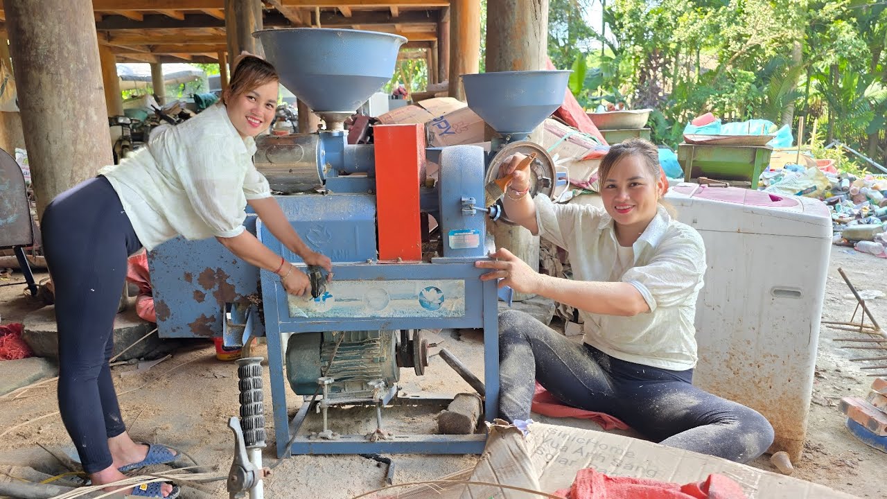 The girl repaired and restored the electric moter of the scrap rice for her neighbor.