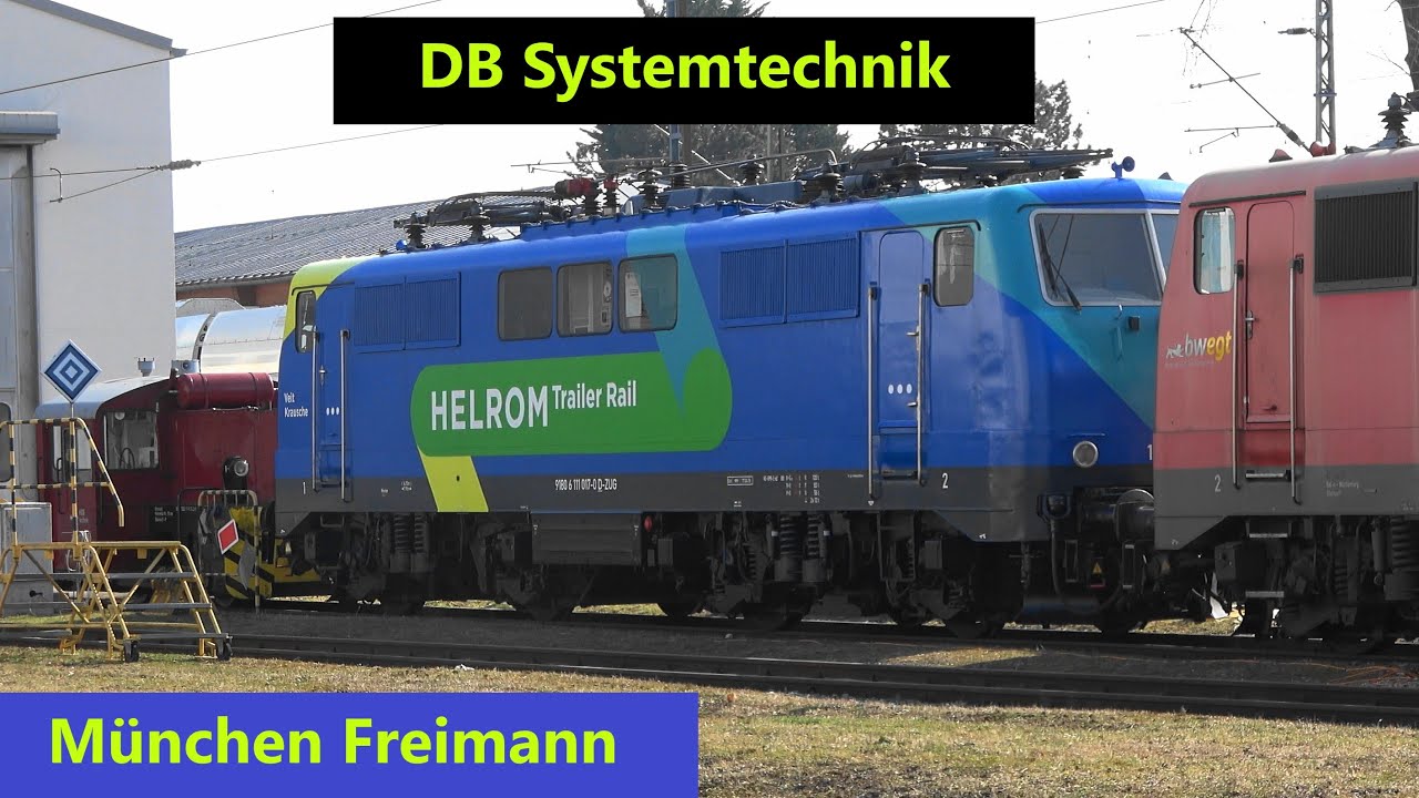 München Freimann: 111 017 HELROM Trailer Rail, WESTbahn bei DB Sytemtechnik, Güterzugbegegnung
