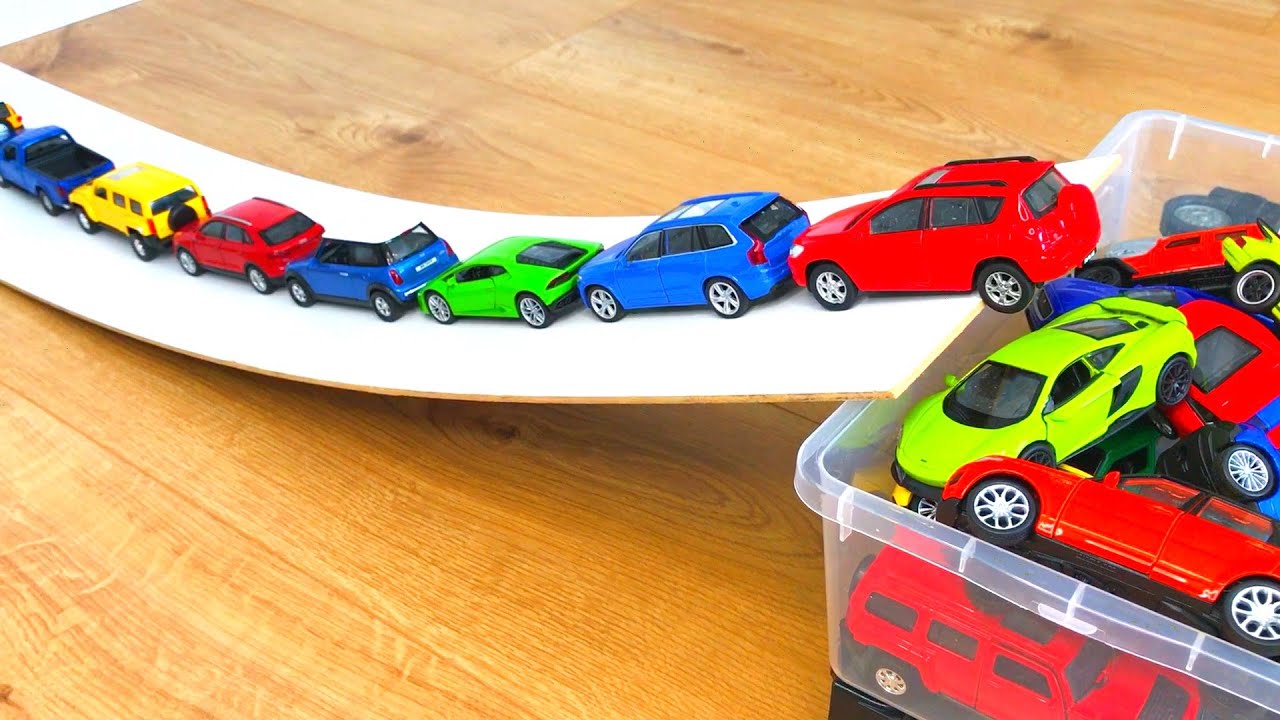Various Diecast Model Cars Moving Down On Slider