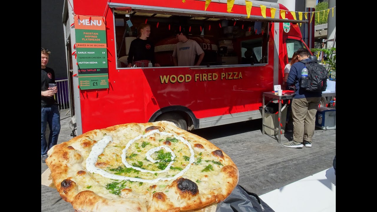 Garlic Butter Naan Bread topped with Cheese freshly made in a Wood Fired Oven on a Mobile Food Truck