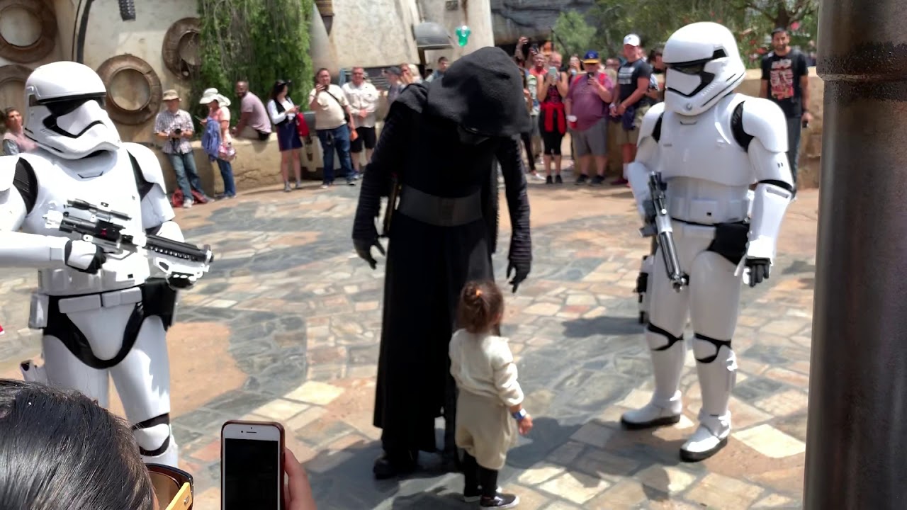 Rey hugs Kylo Ren in front of Savi’s Workshop
