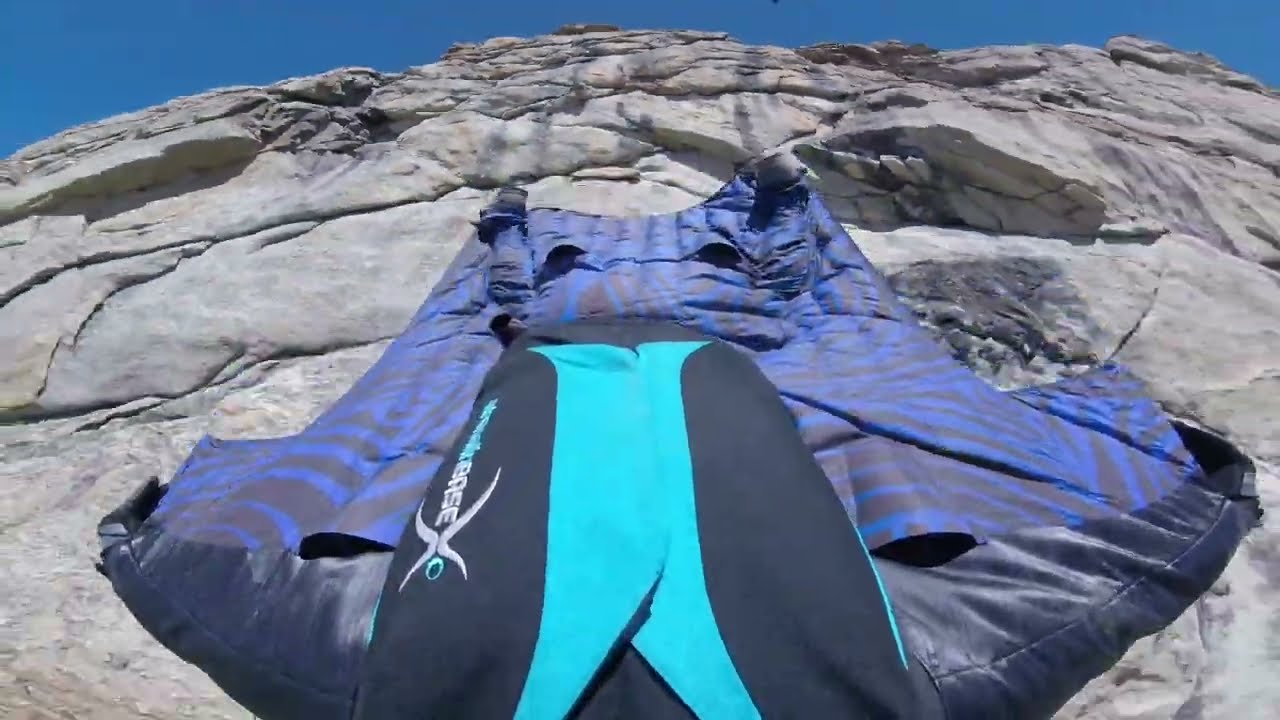 A high desert valley wingsuit jump.
