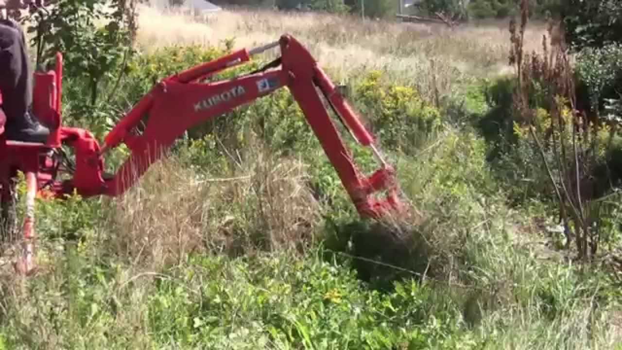 Kubota BX working on a hill