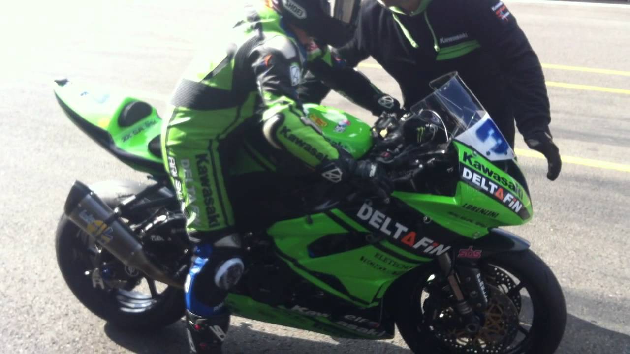 Kawasaki DeltaFin riders leaving pit lane