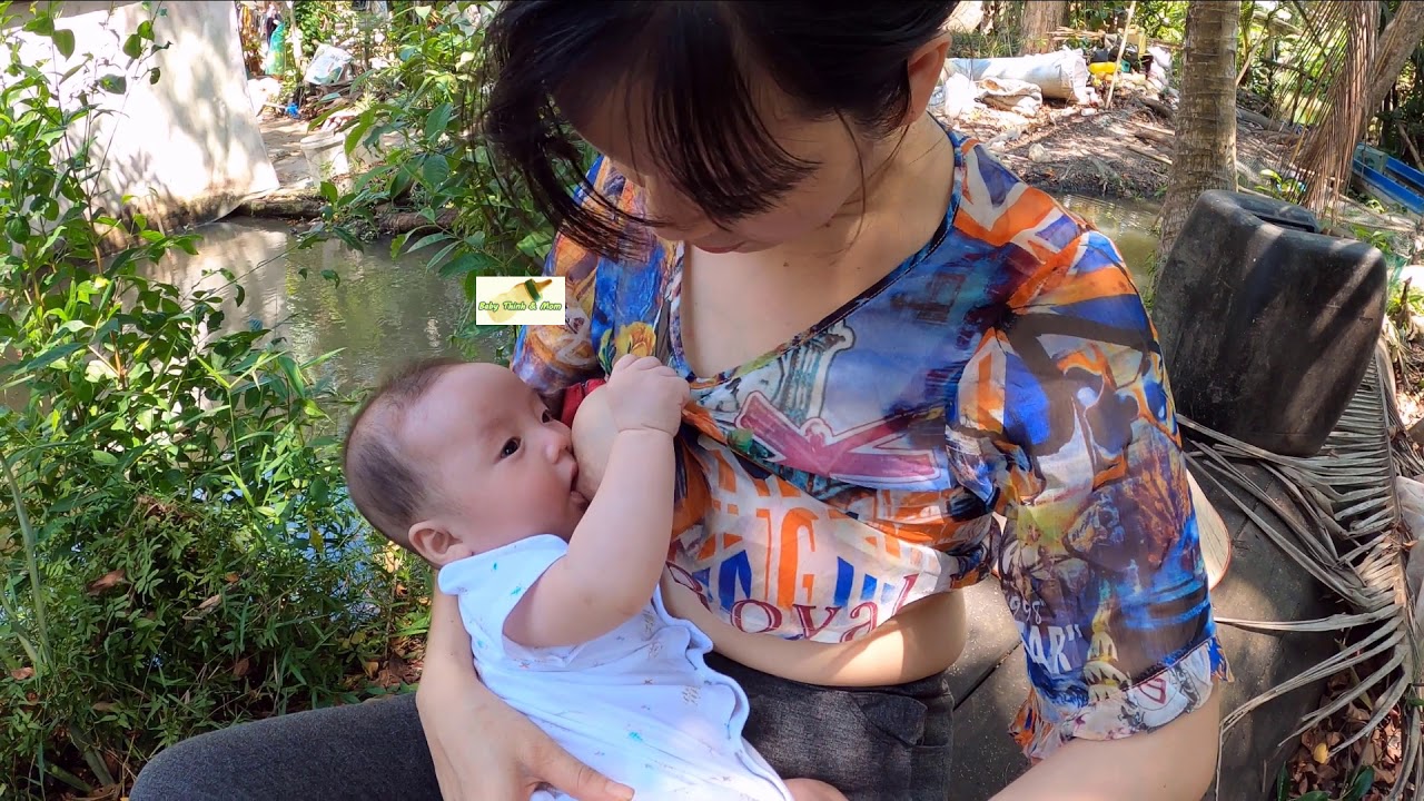 Breastfeeding on a broken boat in my parents' home