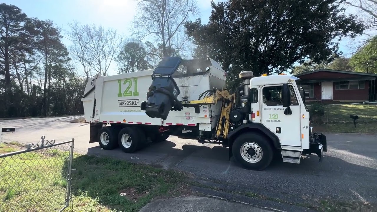 121 disposal Kenworth python side loader garbage truck near the end of the route 