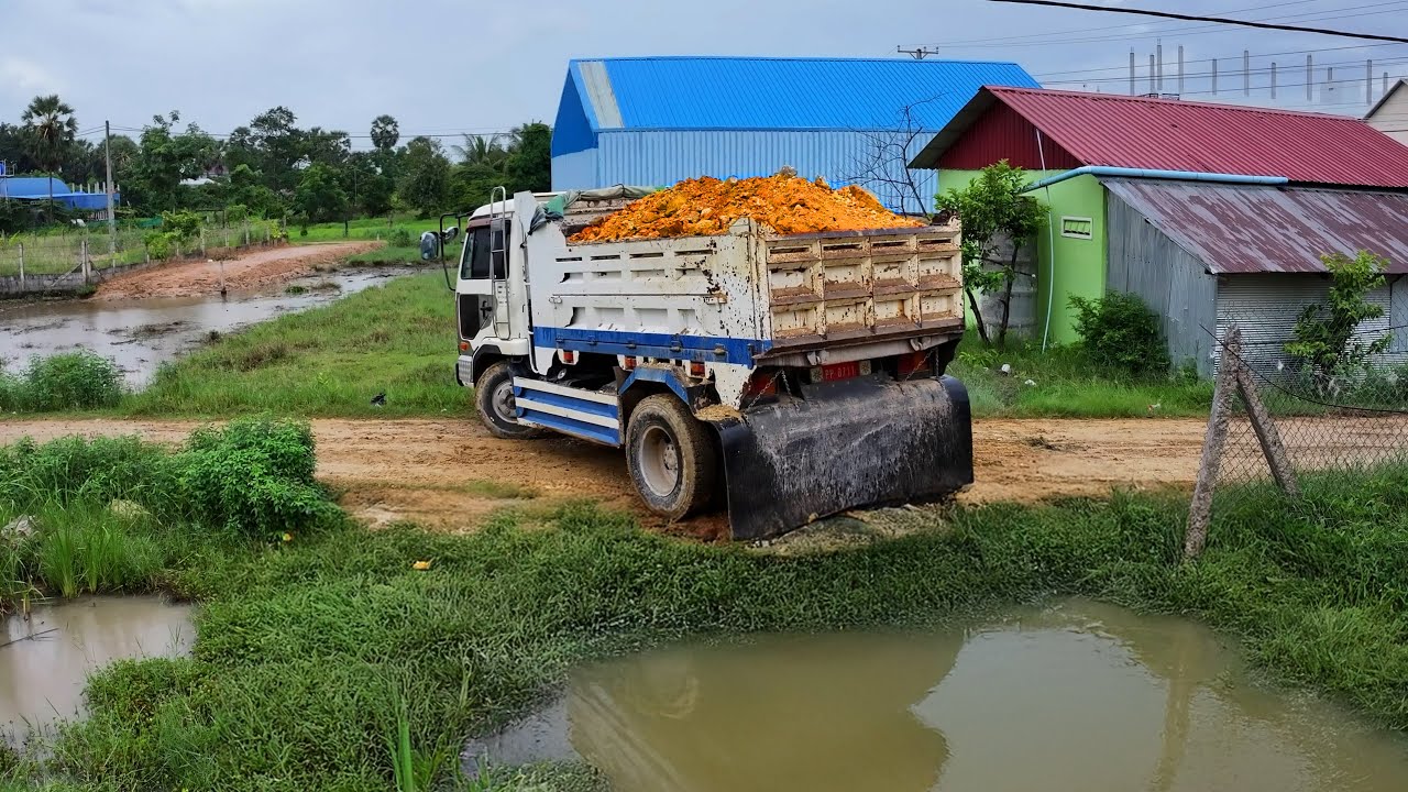 incredible landfill making house , dump truck transport soil ,bulldozer komatsu d20p push soil