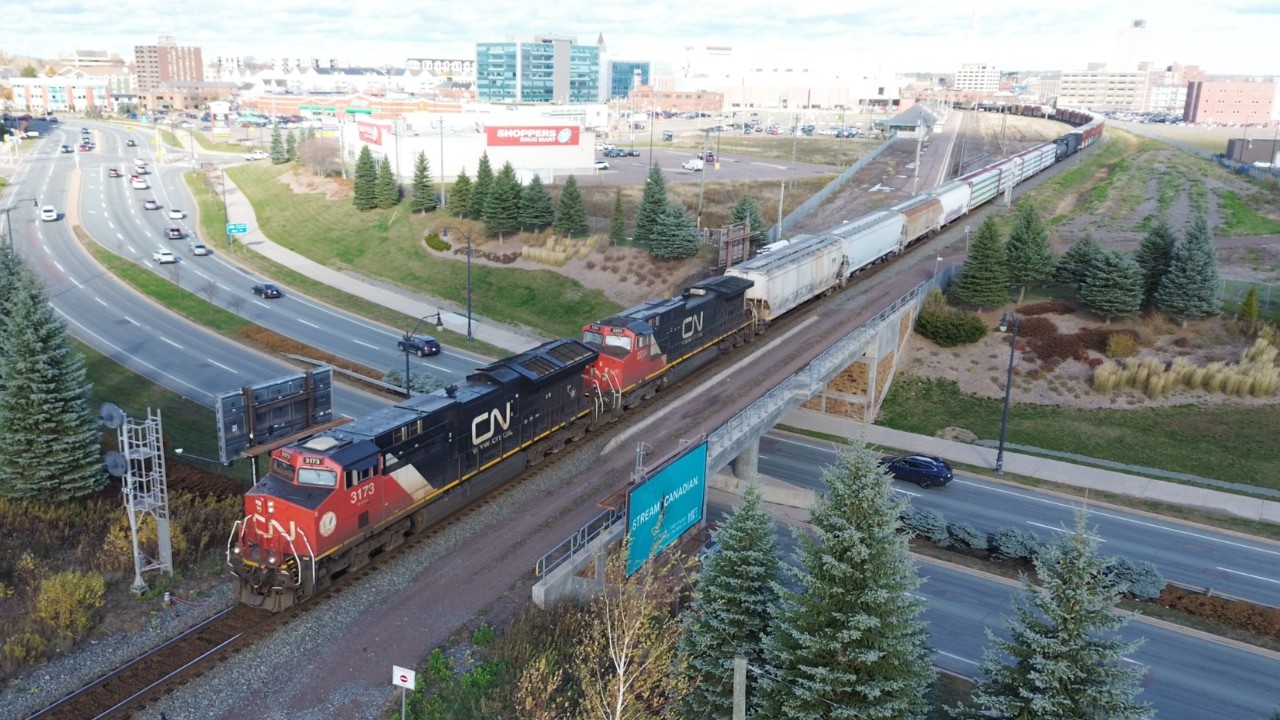Awesome Aerial 4K View! Elly Style Power Leads Freight Train CN 507 thru Downtown Moncton, NB