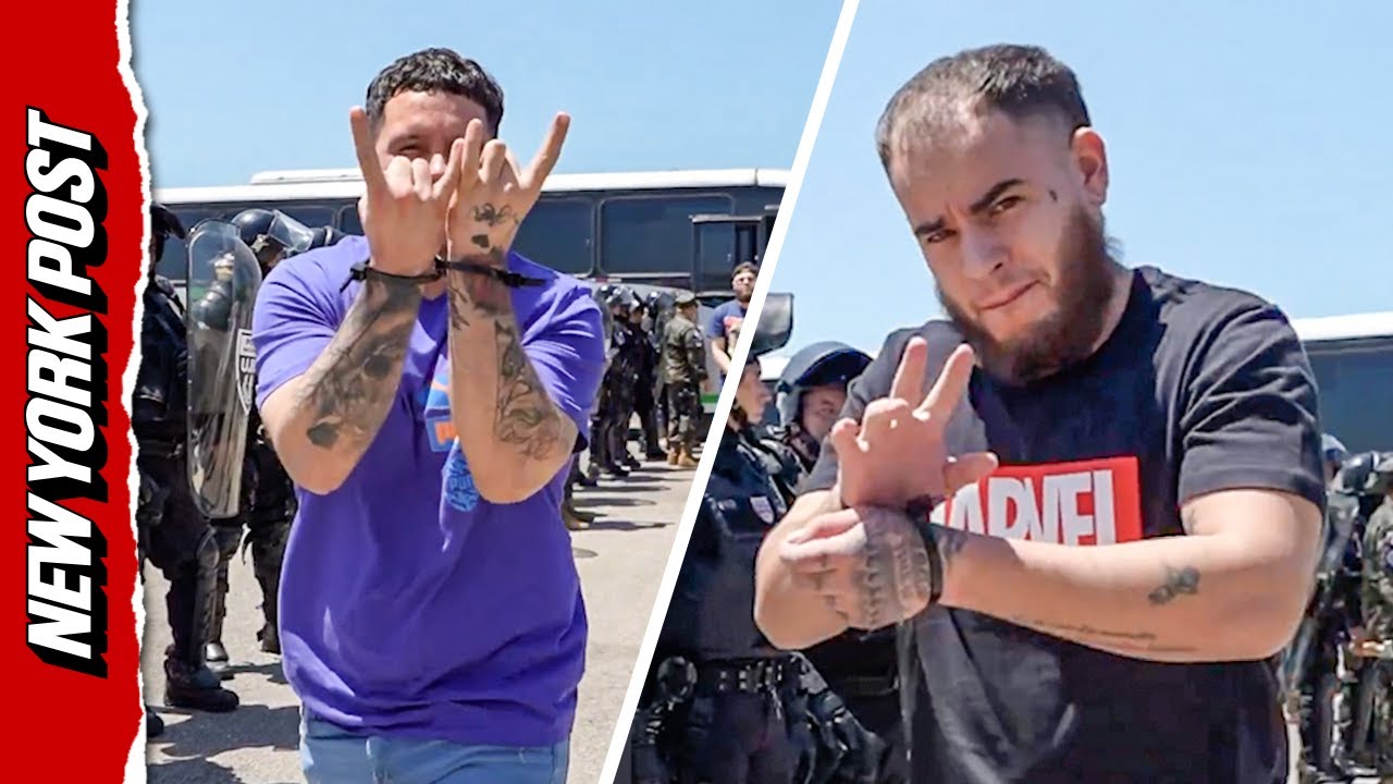 Tren de Aragua suspects pose for the camera as they&rsquo;re sent back to Venezuela