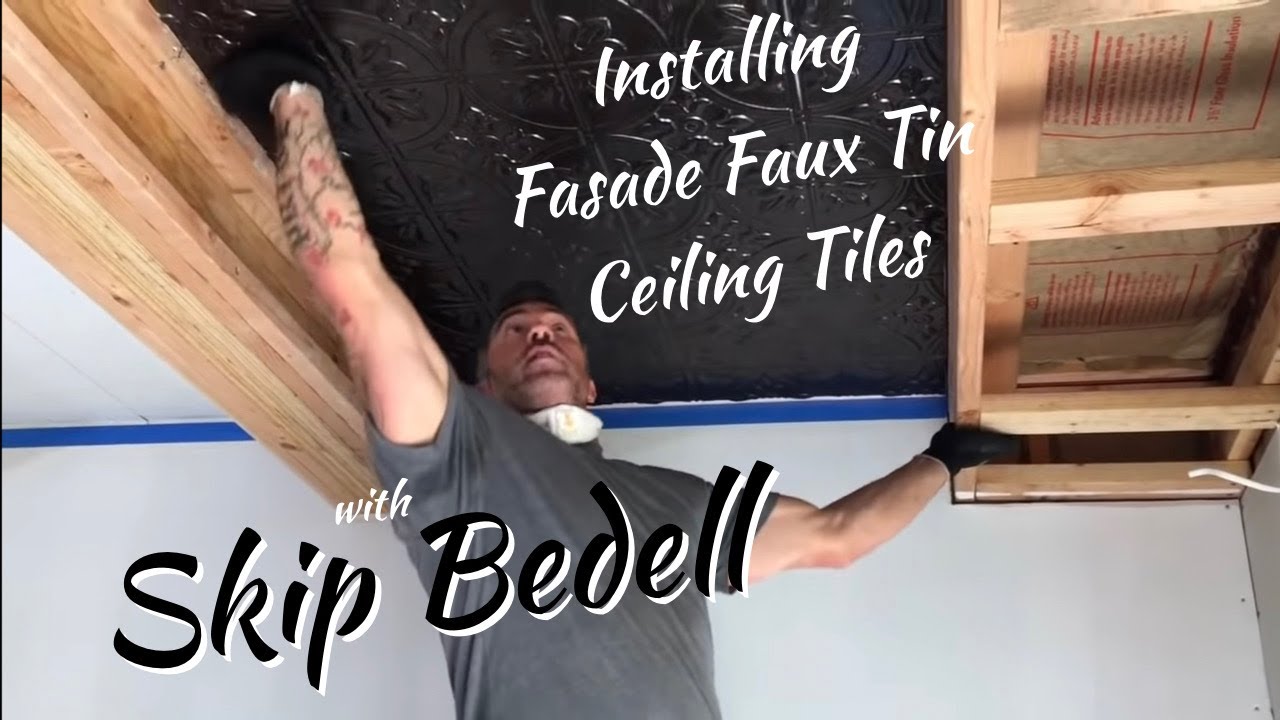 Skip Bedell installing Fasade stamped ceiling tiles