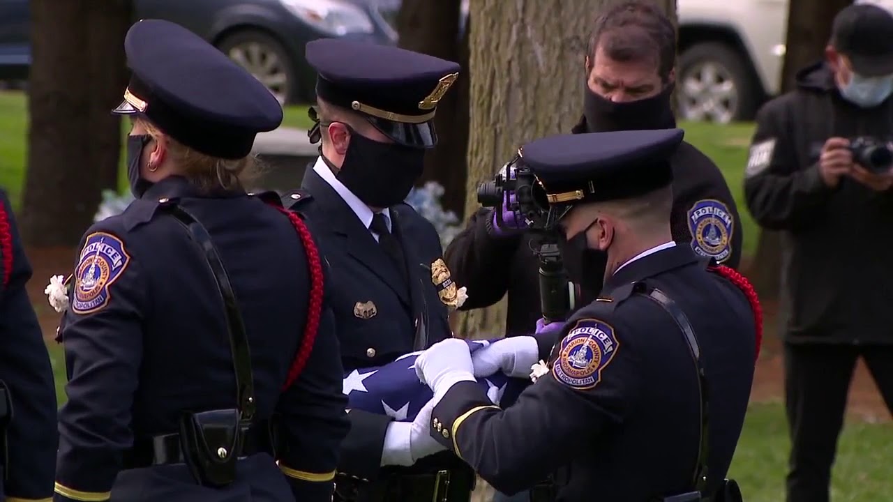 Flag presentation ceremony for parents of IMPD Officer Breann Leath