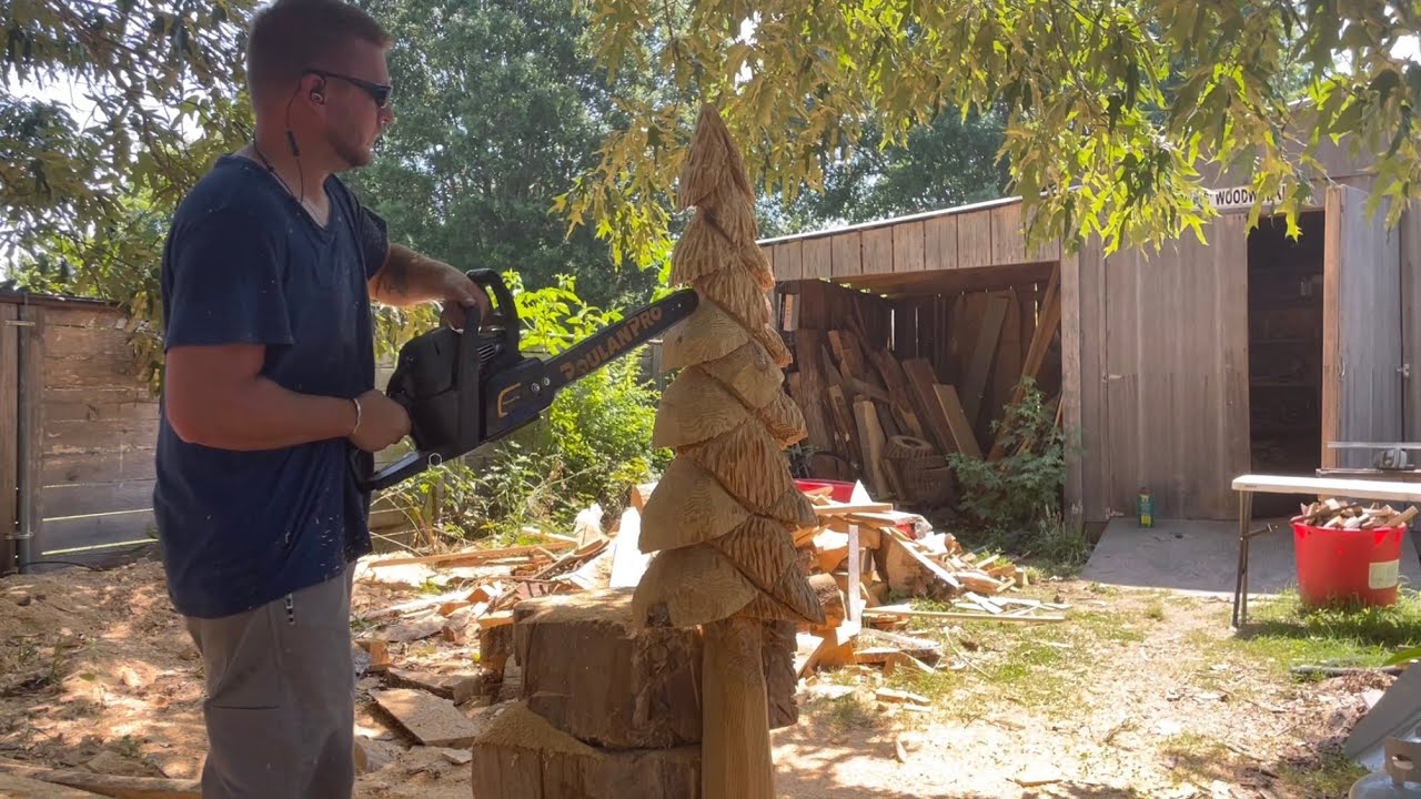Chainsaw carving a 6ft tall tree.